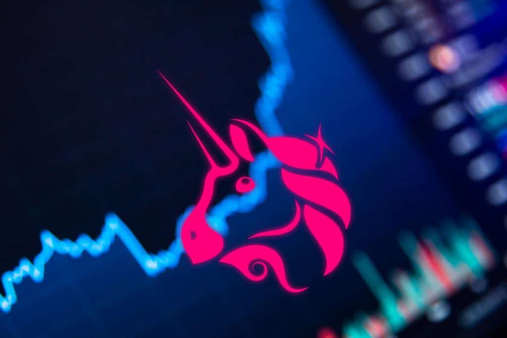 Uniswap-UNI-logo-with-background-of-price-trading-charts